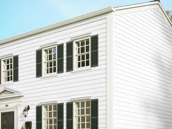 Elegant white house showcasing HardiePlank® Lap Siding with sleek horizontal lines for a timeless exterior look.