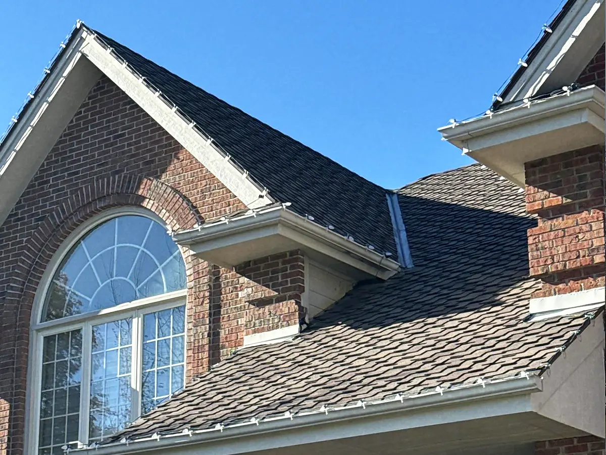 Residential roof with visible structural issues and aging vent system, prepared for repair.