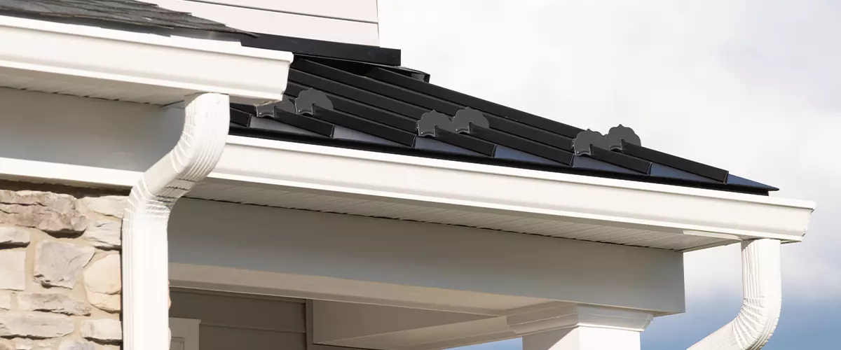 New rain gutter on a home against blue sky